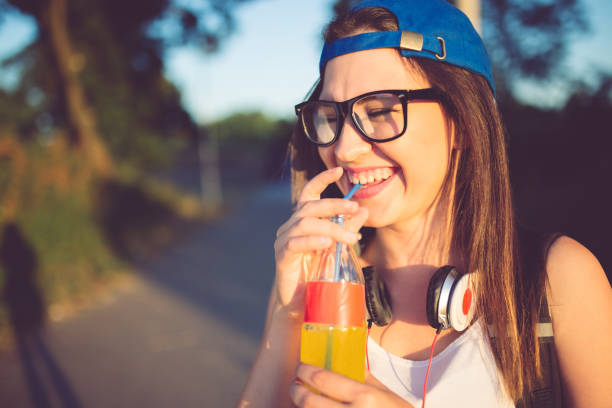 istock Girl drinking juice 1135261108