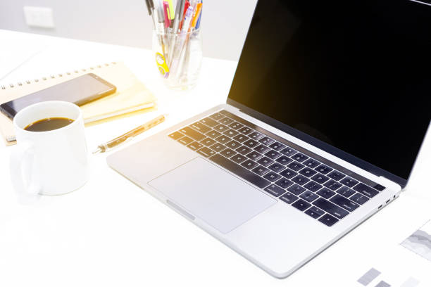 istock Businessman workspace laptop with coffee cup ,computer screen graphics and charts 1135266169