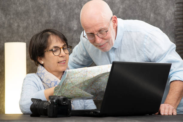istock Senior couple preparing a vacation trip 1135266362