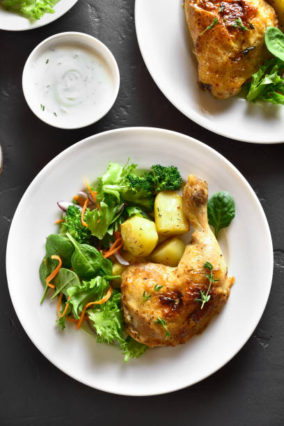 istock Roasted chicken leg with potato 1135267770