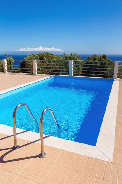 istock Blue swimming pool steps sky and sea 1135268363