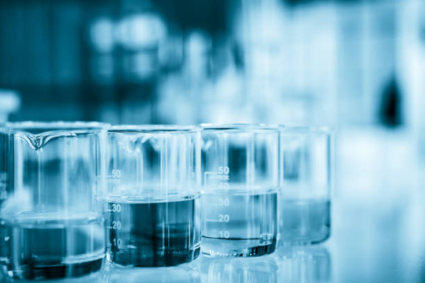 istock Glassware containing chemical liquid in laboratory, lab chemical research and development concept, blue tone 1135268940