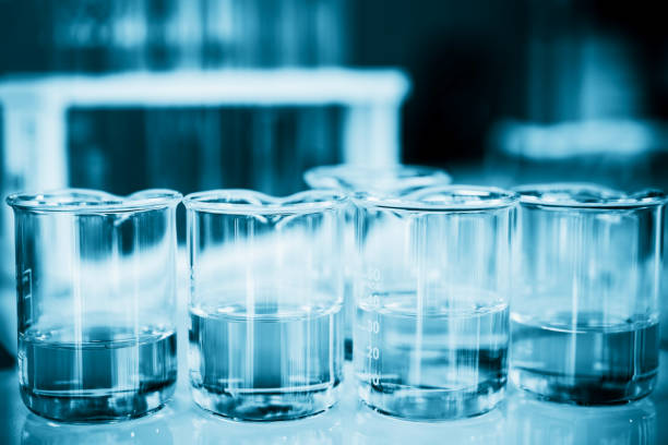 istock Glassware containing chemical liquid in laboratory, lab chemical research and development concept, blue tone 1135268942