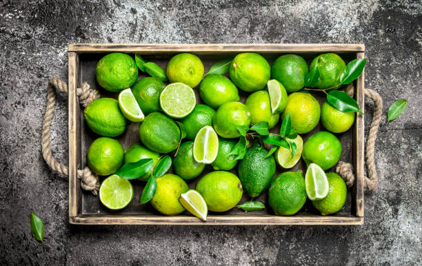istock Fresh lime and slices of ripe lime on tray. 1135269820