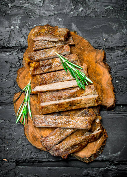 istock Grilled sliced beef steak with rosemary. 1135269896