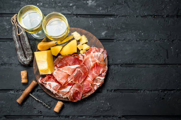 istock Antipasto background.Italian appetizers with white wine. 1135270050