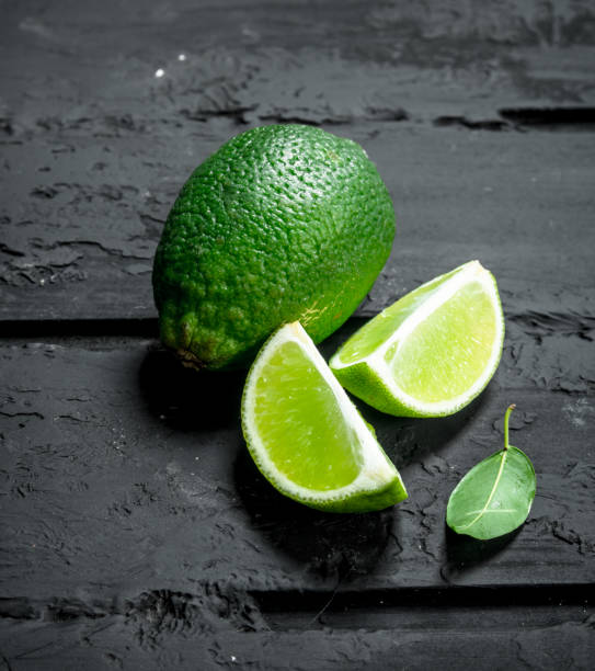 istock Pieces of fresh lime and one whole lime. 1135270227