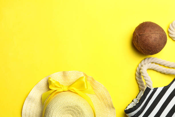 istock Striped beach bag, straw hat and coconut 1135270273