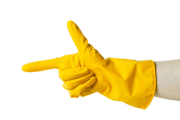istock Hand in a rubber glove shows gestures. Symbolism. On white background. 1135271944