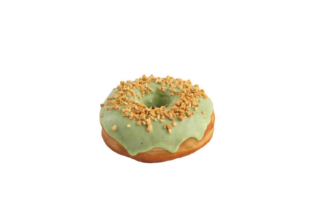istock Appetizing donut with pistachios on a white background. Isolated. 1135273060