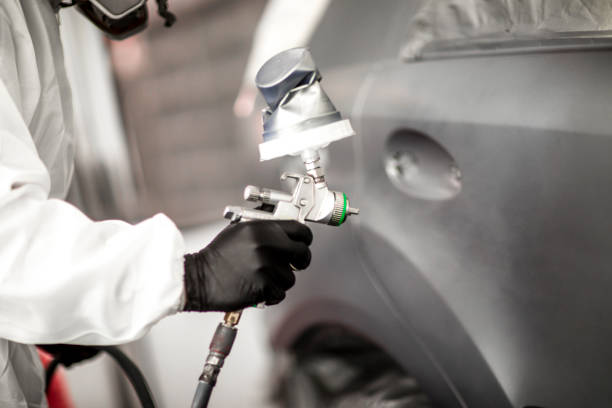 istock Spraying a coat of paint on a car part 1135274142
