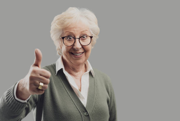 istock Cheerful senior lady giving a thumbs up 1135274143