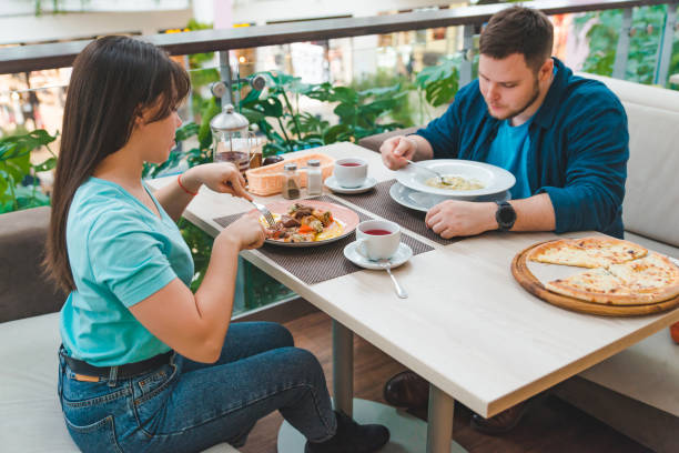 istock couple having lunch in mall cafe together. date talking 1135276939