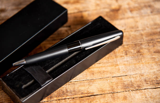 istock Black pen on a wooden table 1135277331