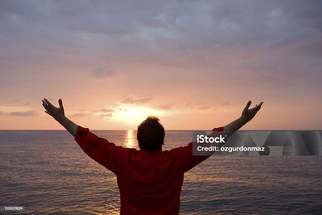 Hombre en puesta de sol - Foto de stock de Personas libre de derechos