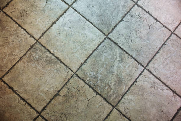 istock Old grey tiles on the floor. Texture background. 1135278842