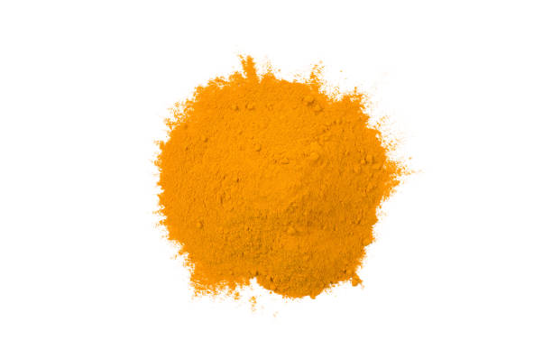 istock turmeric heap isolated on white background. top view 1135278922