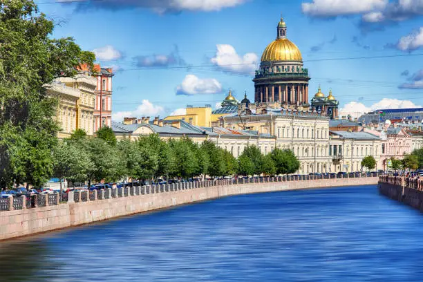 The embankment of the river Moika, St. Isaac's Cathedral at sunset in autumn in St. Petersburg