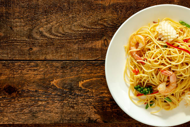 istock spicy spaghetti with seafood on plate. 1135280501