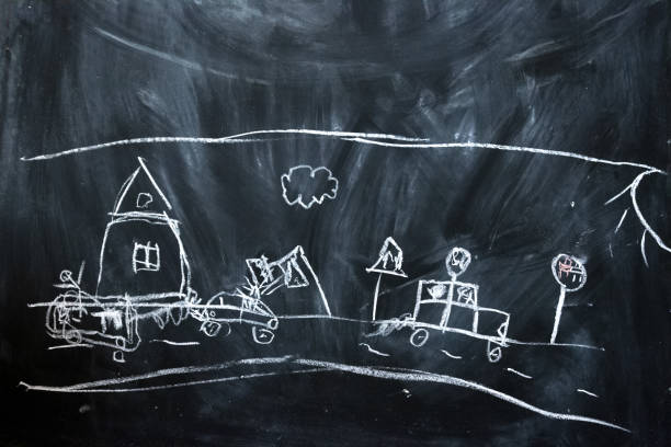 istock children drawing on black chalkboard with chalk 1135282278