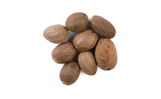 istock nutmeg heap isolated on white background. top view 1135282345