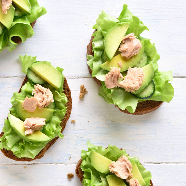 istock Tuna sandwiches with avocado and lettuce leaves 1135283444