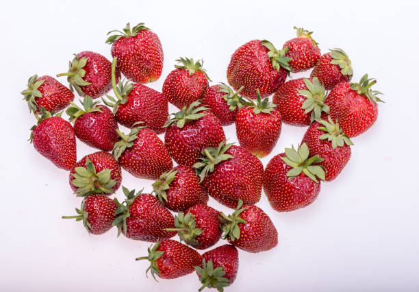 istock fresh ripe strawberries isolated on white background 1135286163