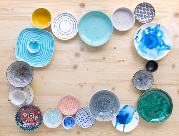 istock colourful crockery on light wood background 1135287355