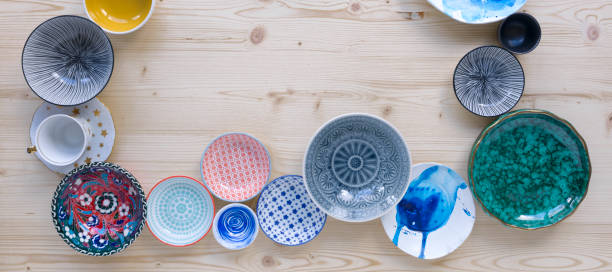 istock colourful crockery on light wood background 1135287411