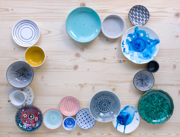 istock colourful crockery on light wood background 1135287482