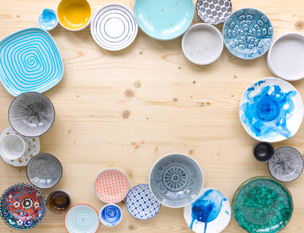 istock colourful crockery on light wood background 1135287493