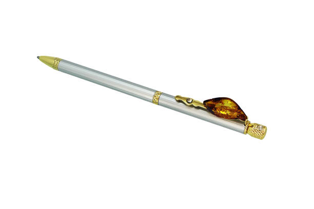 istock Ballpoint pen with a piece of amber 1135287843