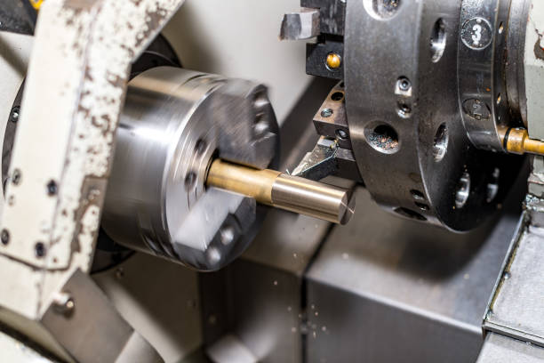 istock metal blank machining process on lathe with cutting tool 1135288824