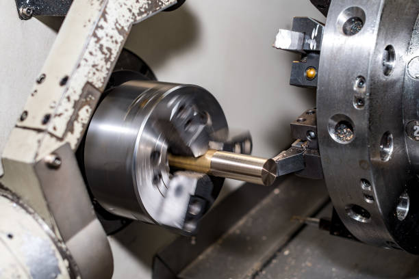 istock metal blank machining process on lathe with cutting tool 1135288847