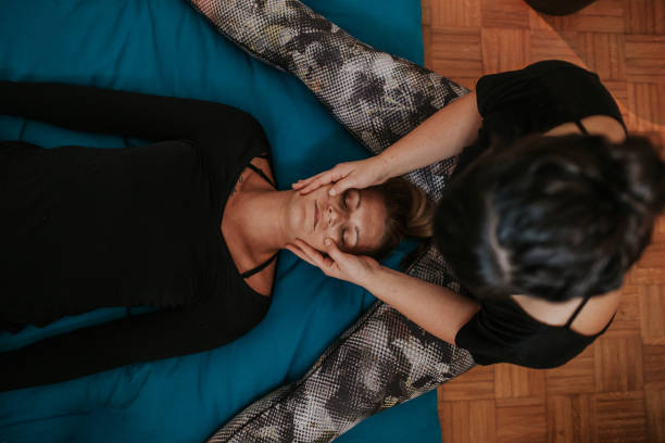 istock Young female receiving face massage, top view 1135288933