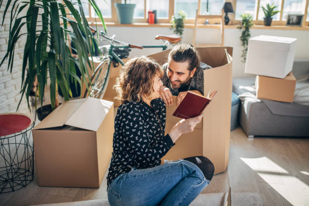 istock Couple having fun in new home 1135288982