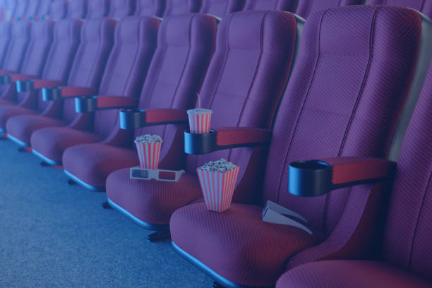 istock 3D illustration with 3d glasses, popcorn, cup with a drink. Cinema concept wtih blue light. Red chairs in the cinema hall. 1135289211