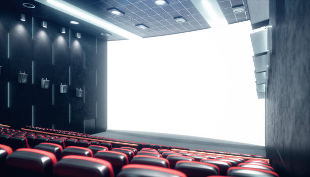 istock Cinema hall with blank screen and empty seats. Modern design with striking lighting, neon lighting. Audio system on the walls. Cinema hall without people. White screen with copy space, 3D illustration 1135289230