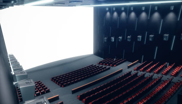istock Cinema hall with blank screen and empty seats. Modern design with striking lighting, neon lighting. Audio system on the walls. Cinema hall without people. White screen with copy space, 3D illustration 1135289234