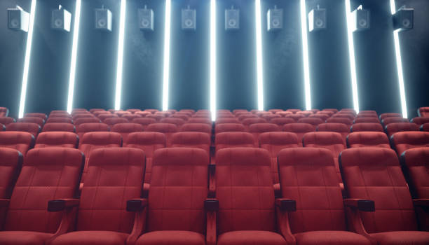 istock Cinema hall with blank screen and empty seats. Modern design with striking lighting, neon lighting. Audio system on the walls. Cinema hall without people. White screen with copy space, 3D illustration 1135289241
