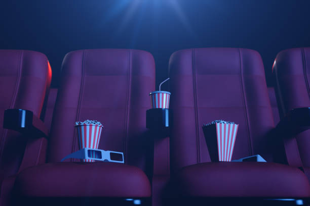 istock 3D illustration with 3d glasses, popcorn, cup with a drink. Cinema concept wtih blue light. Red chairs in the cinema hall. 1135289271