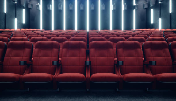 cinema hall with blank screen and empty seats. modern design with striking lighting, neon lighting. audio system on the walls. cinema hall without people. white screen with copy space, 3d illustration - empty theater imagens e fotografias de stock