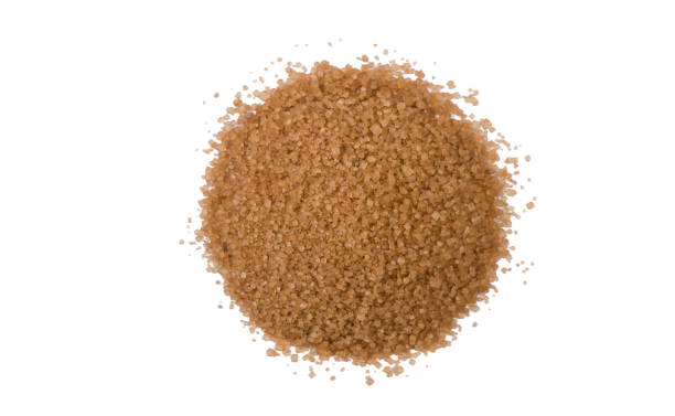 istock Brown or cane sugar heap isolated on white background. top view 1135289345