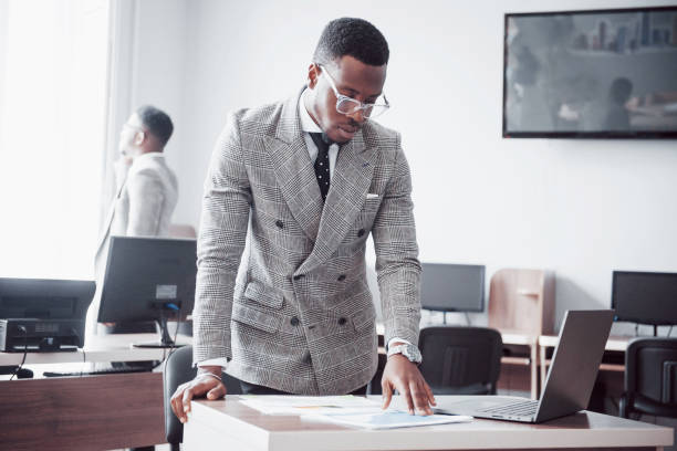 istock Two handsome cheerful african american executive business man at the workspace office 1135291529