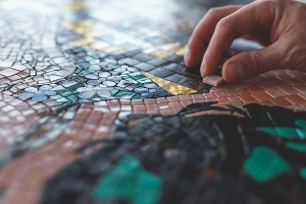 istock Men's hands with mosaic 1135292414