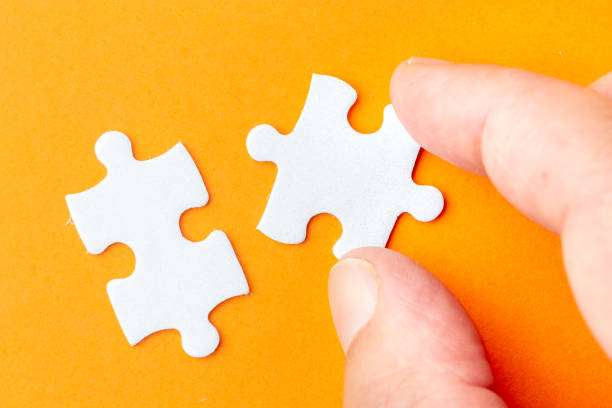 istock Creating or building own business concept. Puzzle piece, construction and development concept 1135292451