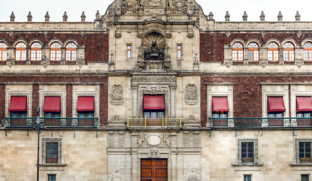 The beautiful colonial style facade of the Palacio Nacional seat of the Presidency of the Republic in Mexico City stock photo