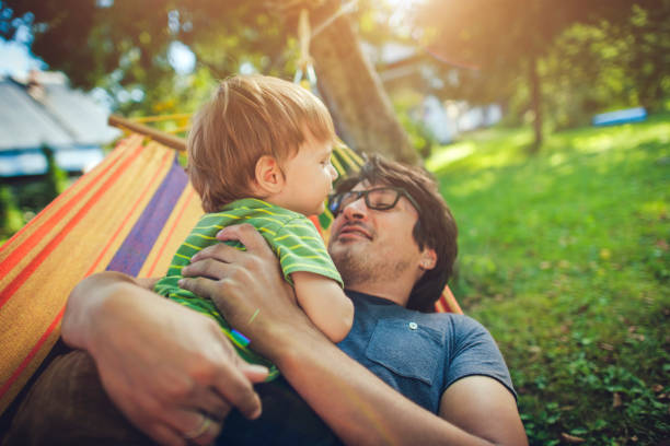 istock Family enjoying spring/summer day in hammock 1135294250
