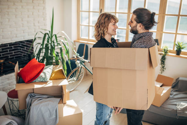istock Couple having fun in new home 1135294278