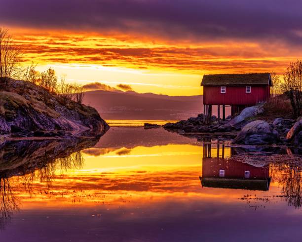 Midnight sun in Norway A magical night in norwegian fjord Saltstraumen midnight sun stock pictures, royalty-free photos & images